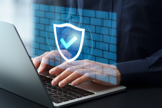 Firewall and network protection. Internet security system. Businessman using laptop computer. Shield and check mark icon.