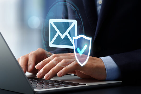 AI email security software. Secure mail filtering and protection systems. Shield and check mark icon. Businessman using laptop computer.