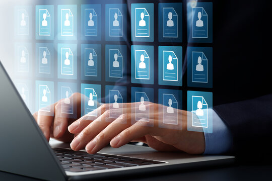 Recruitment management system and technologies. Applicant tracking and hiring process automation software. Businessman using candidate selection application on laptop computer.