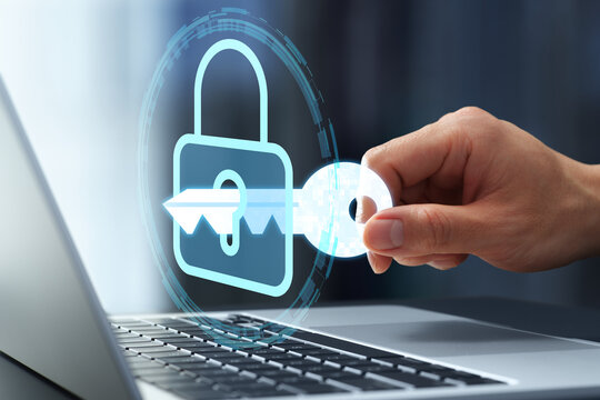 Secure user authentication and network access control. Security system and encryption key. Businessman using passkey for identity verification on laptop computer.