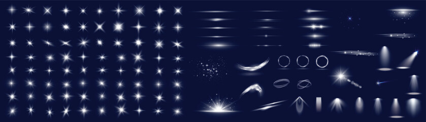Collection of bright white lens flares and light effects on dark background © GRAPHIC ZONE