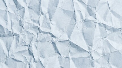 Fototapeta premium Intricate crumpled white paper texture with sharp diagonal creases and subtle blue-grey highlights