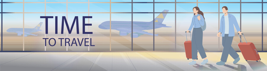 Young couple walking through an airport terminal with suitcases, heading for departure. Travel and tourism concept with panoramic windows and airplanes in the background.