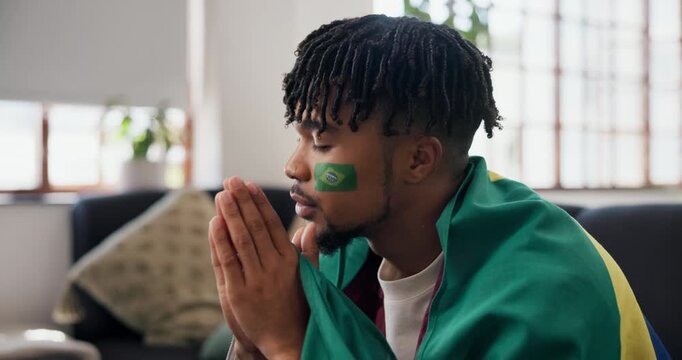 Man, sports and brazil flag in house for watching tv, football match loss or upset for game defeat. Disappointed, black person and broadcast in home with soccer world cup, stress or competition fail.