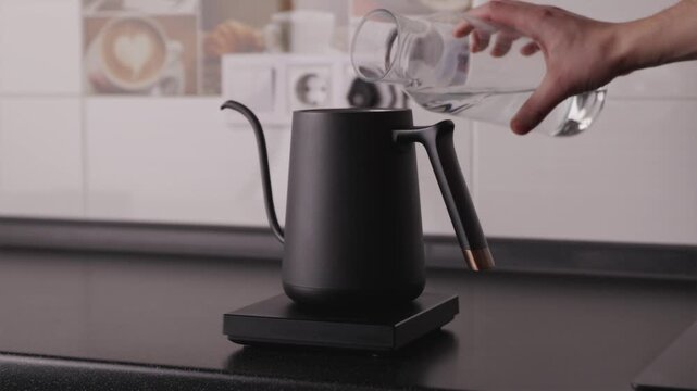 Filling professional electric gooseneck kettle with filtered water