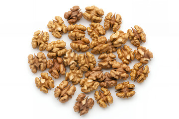Obraz premium Loose walnuts on white background scattered brown