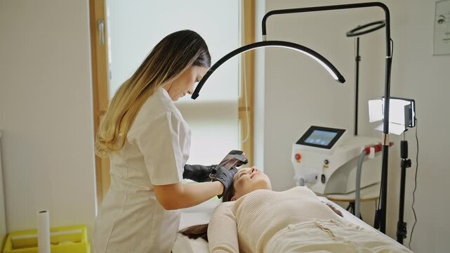 Microblading eyebrow procedure in modern beauty clinic