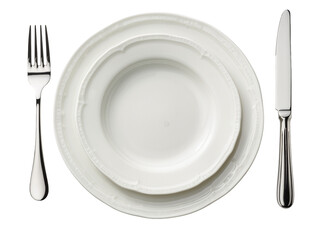 Elegant dining place setting with two stacked white ceramic plates, a silver fork, and a knife,...