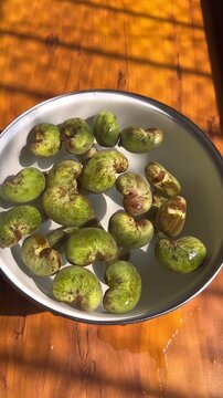 Raw green cashew in a bowl