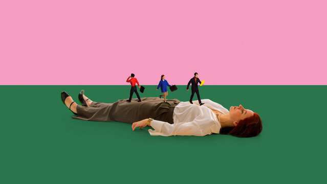 Businesswoman lying still while tiny office workers walk across her body on colorful background. Concept of burnout, stress overload, career pressure, and work life imbalance in modern business.