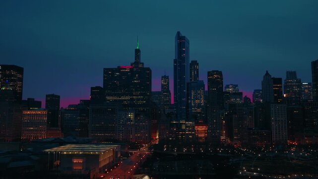 An establishing shot of a major city's critical infrastructure, representing healthcare systems and round-the-clock public safety.