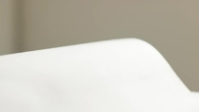 Closeup of white toilet bowl.