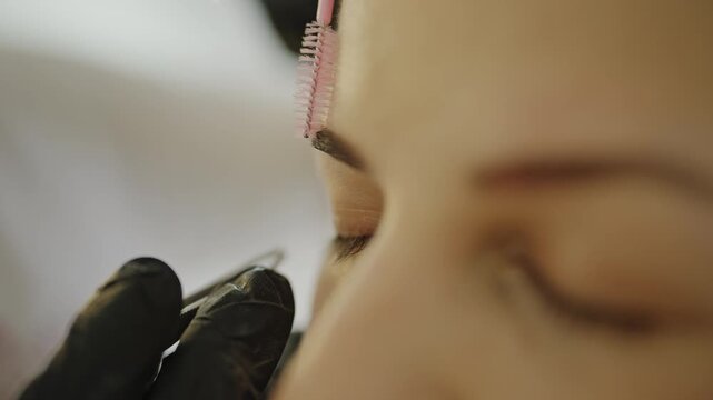 Precision eyebrow grooming with tweezers and spoolie brush
