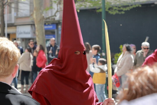 Red-robed penitent during La Borriquita procession in Talavera de la Reina, Spain