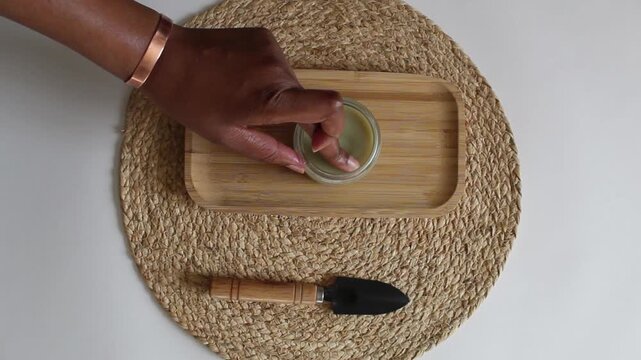 Rubbing Moringa Hair Butter Between Fingers