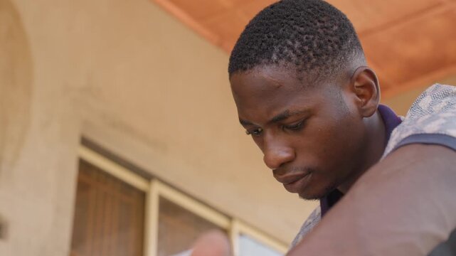 Athlete pauses again. Competitor takes momentary rest following rigorous exercise session. Dedicated sports participant temporarily ceases activity to regain strength for continued performance