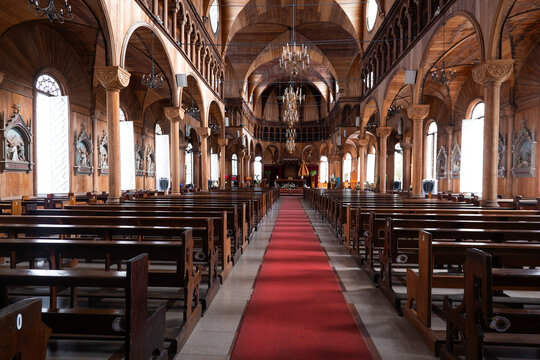 View of the interior of the Saint Peter and Paul Cathedral with its impressive wooden architecture and red carpet aisle in Paramaribo, Paramaribo District, Suriname.
