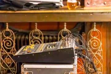 Audio mixer soundboard with cables at a pub © Richard Semik