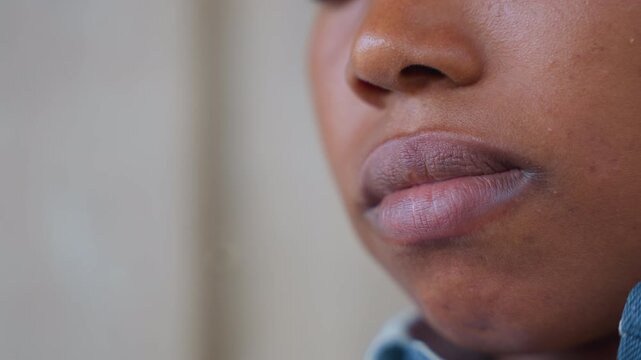 Intimate view of mouth. Focused image capturing lips after eating. Detailed closeup of lips showing after meal consumption. An intimate closeup shot emphasizing lips following act of eating