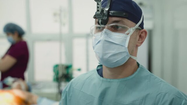 Caucasian surgeon doctor man specialist in medical uniform posing in operating room male practitioner physician professional in hospital portrait surgical operation plastic surgery medicine health