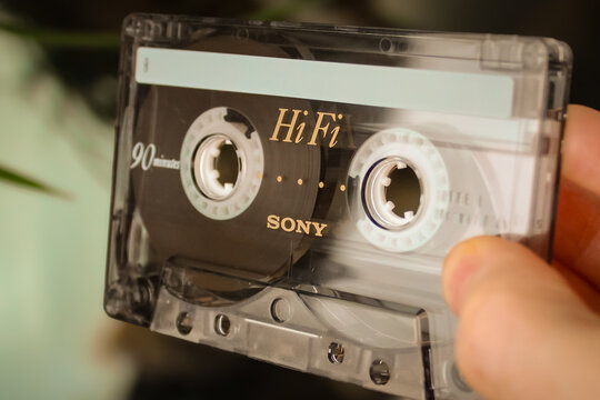 Minneapolis, USA - March 27, 2026: Closeup of a person holding a vintage Sony HF 90 audio cassette tape. A staple in 1980s and 1990s analog audio recording and playback. For Editorial Use Only.