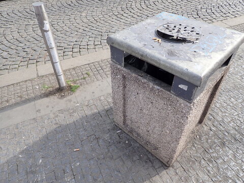 city street rubish bin on a pavement
