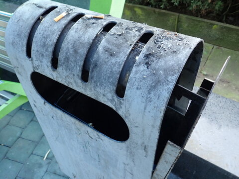 city street rubish bin on a pavement