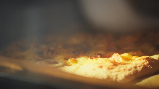 Mouthwatering homemade pizza bakes inside scorching kitchen oven. This close-up view captures gooey cheese bubbling golden dough expanding as authentic Italian culinary artistry unfolds to completion