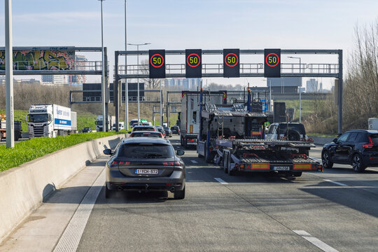 Antwerp, Belgium, Netherlands, 4 March 2026. Heavy Traffic Jam on Highway Ring Road in Belgium with Electronic Speed Limit Signs Displaying Fifty Kilometers Per Hour During Day.