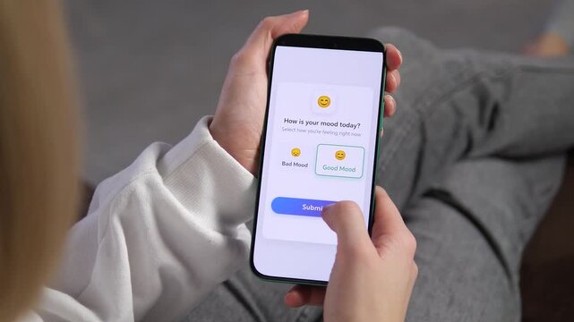 Recording positive emotions in a digital mood journal. A user interacts with a clean mobile application interface, choosing Good Mood and waiting for processing. Perfect for self-care, mental wellness