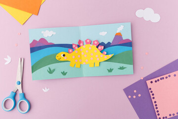 creative diy paper art stegosaurus illustration branding visual content marketing materials handmade craft supplies workspace background childhood concept artistic layout professional photography © Elena