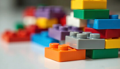 Obraz premium Brightly colored lego bricks arranged in a fun pattern for children to play and create with their imagination on a table.