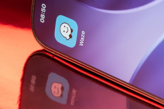 Waze icon application on smartphone screen close up