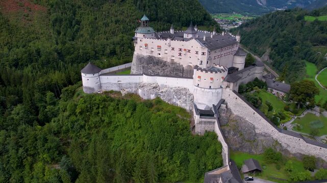 Hohenwerfen Castle Austria Drone Video, Aerial View of Medieval Fortress on Rock with High Alpine Mountains Backdrop, Scenic Werfen Valley Landscape at Morning, Fortress of Salzburg Region 4K