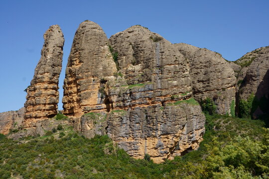 Mallos de Riglos rock formations in Huesca, Spain with dramatic cliffs and blue sky