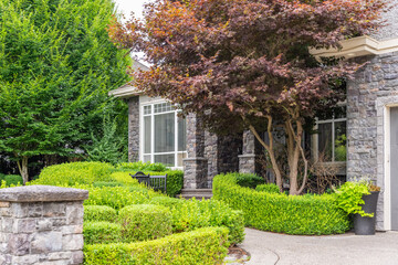 Obraz premium Entrance of luxury house in summer with nice landscape in Vancouver, Canada, North America. Day time on August 2025.