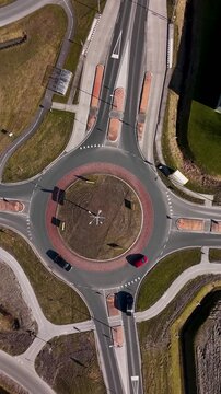 Distorted aerial view of cars driving on a roundabout