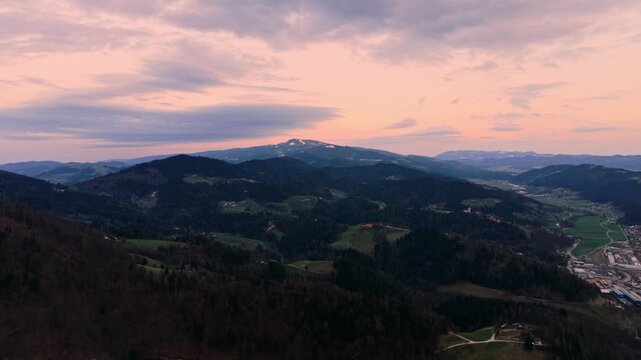 Drone flyover rolling hills at sunset