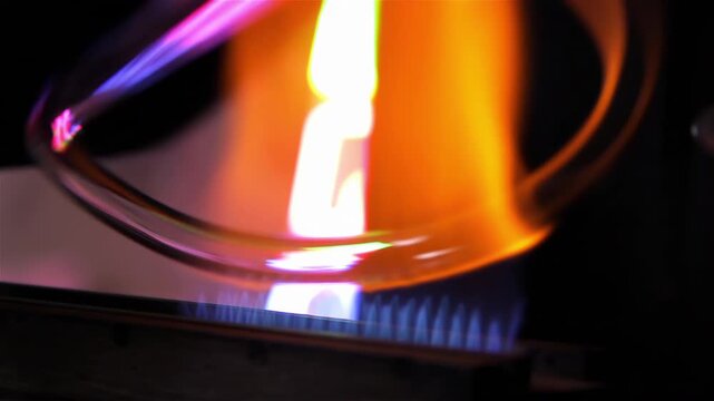 Neon Glass Tube Heated Over Ribbon Burner in Workshop, Close Up - 4K