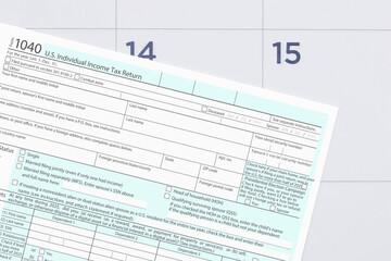 Fototapeta premium Tax form 1040 with calendar deadline concept