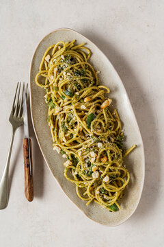Plate of spaghetti with pesto.