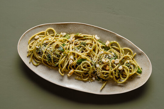 Plate of spaghetti with pesto.