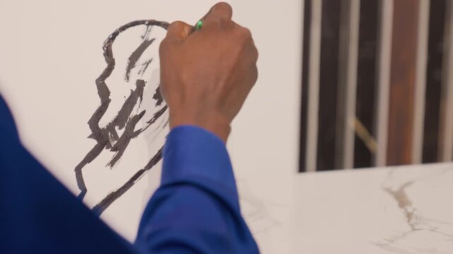 Black painting on easel, final detail of hand adding delicate black strokes with green pencil, refined ear silhouette, blue cuff, peaceful finishing and galleryready composition.