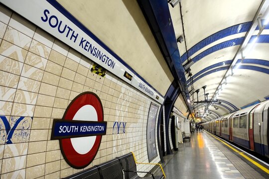South Kensington London Underground tube station roundel sign on the platform
