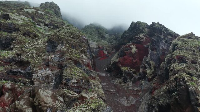 Aerial Panoramic View Dramatic Multi Colored Volcanic Cliffs Red Basalt Clouds Mist El Hierro Canary Islands Spain