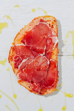 pa amb tomaquet covered with cured ham