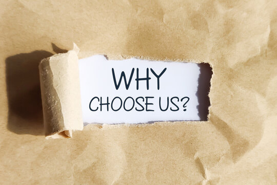 Torn paper opening with &ldquo;Why Choose Us?&rdquo; message, representing brand differentiation, advertising, and persuasive marketing concept.