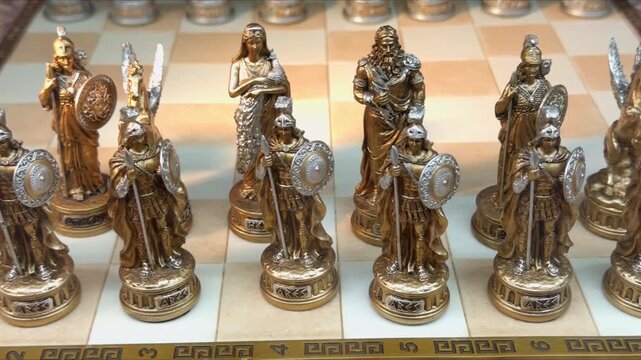 Collectible chess pieces shaped as ancient Greek gods on a board