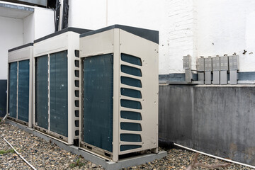 Fototapeta premium Three Haier commercial air conditioning outdoor units installed side by side