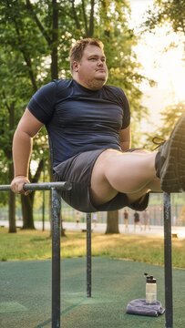 Strong plus-size man performing an advanced L-sit calisthenics move on parallel bars in a sunny outdoor park, showcasing inclusive fitness and determination
